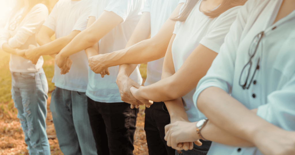 volunteers holding hands