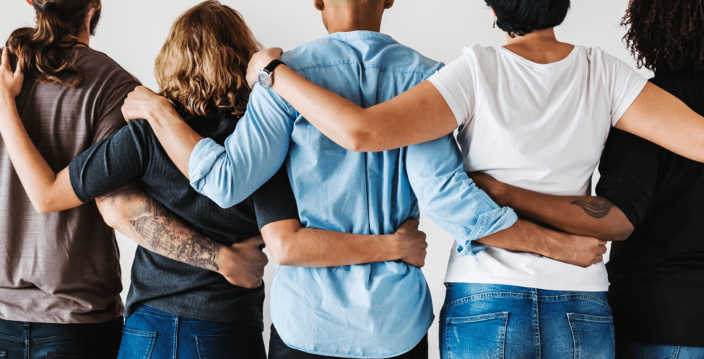 group of people holding each other