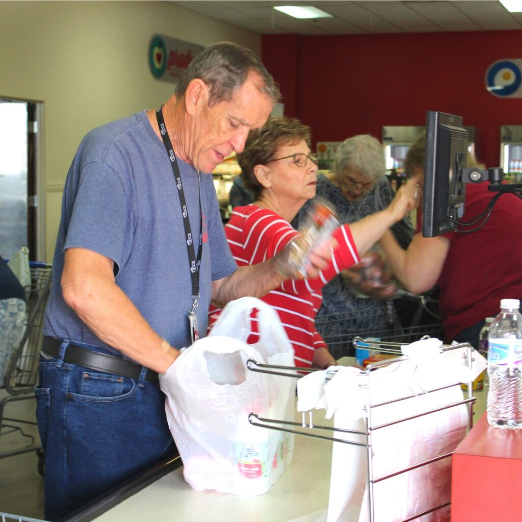Volunteer Adding item at a Cash counter