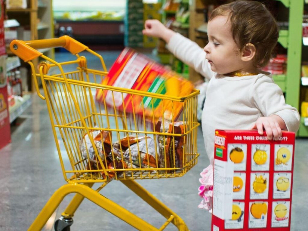 Young child shopping in Christian Community Action's food pantry in Lewisville, Texas