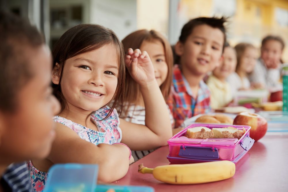 Group of kids eating a school luch