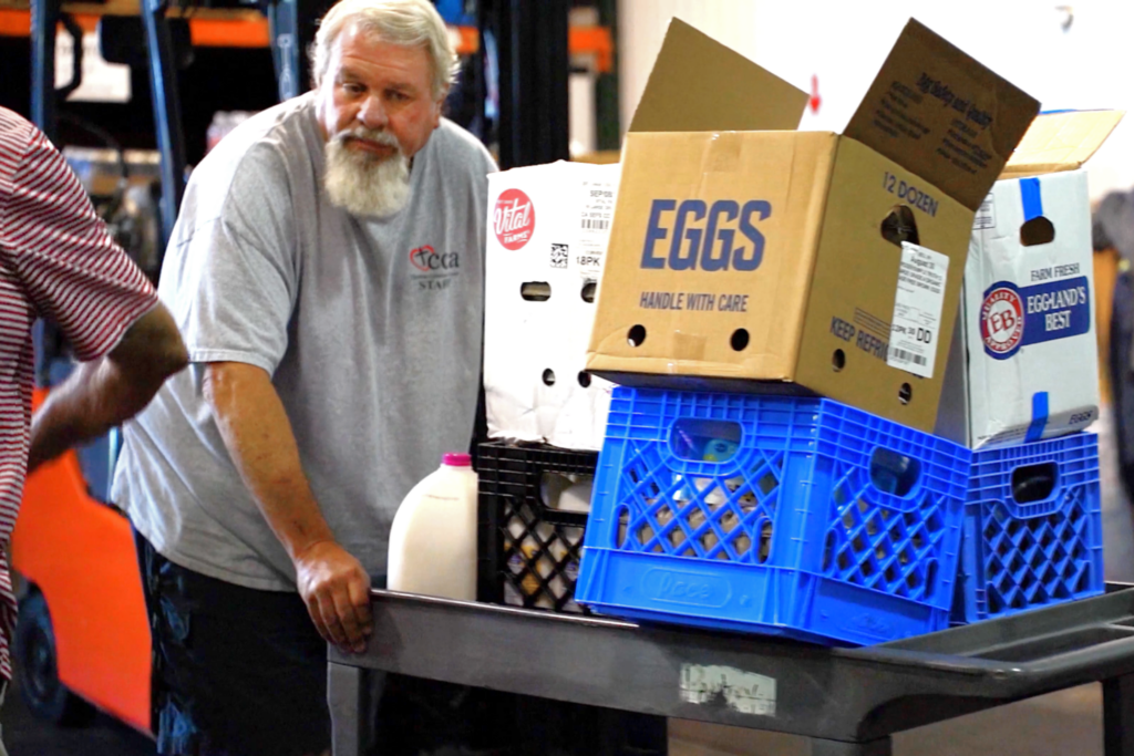 Man volunteering at CCA in Lewisville, Texas.